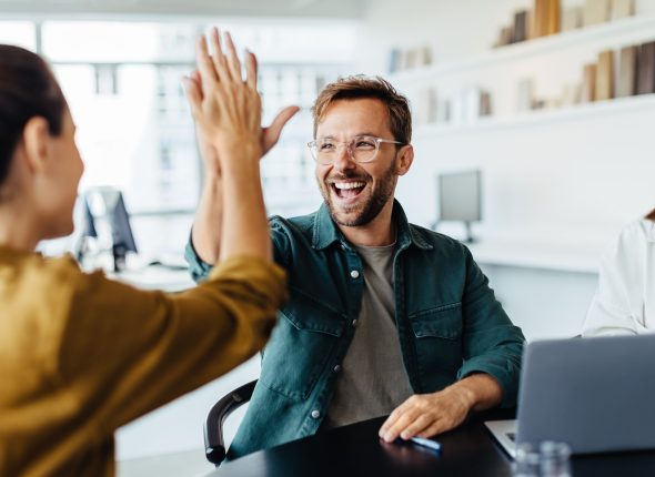 Business people celebrating success in an office